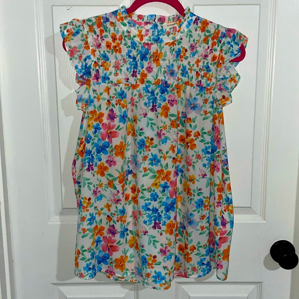 Floral ruffled sleeveless blouse